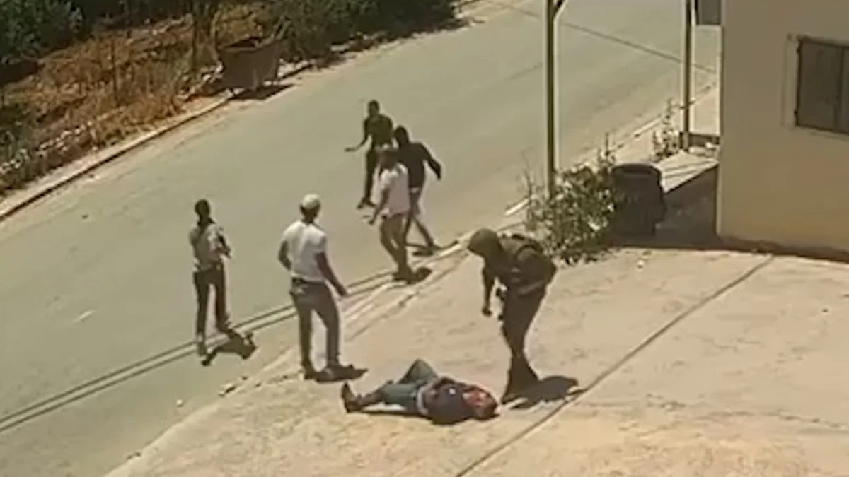 Brutal Assault on Palestinian Youth by Israeli Soldier and Settlers Captured on Surveillance Footage in Occupied West Bank