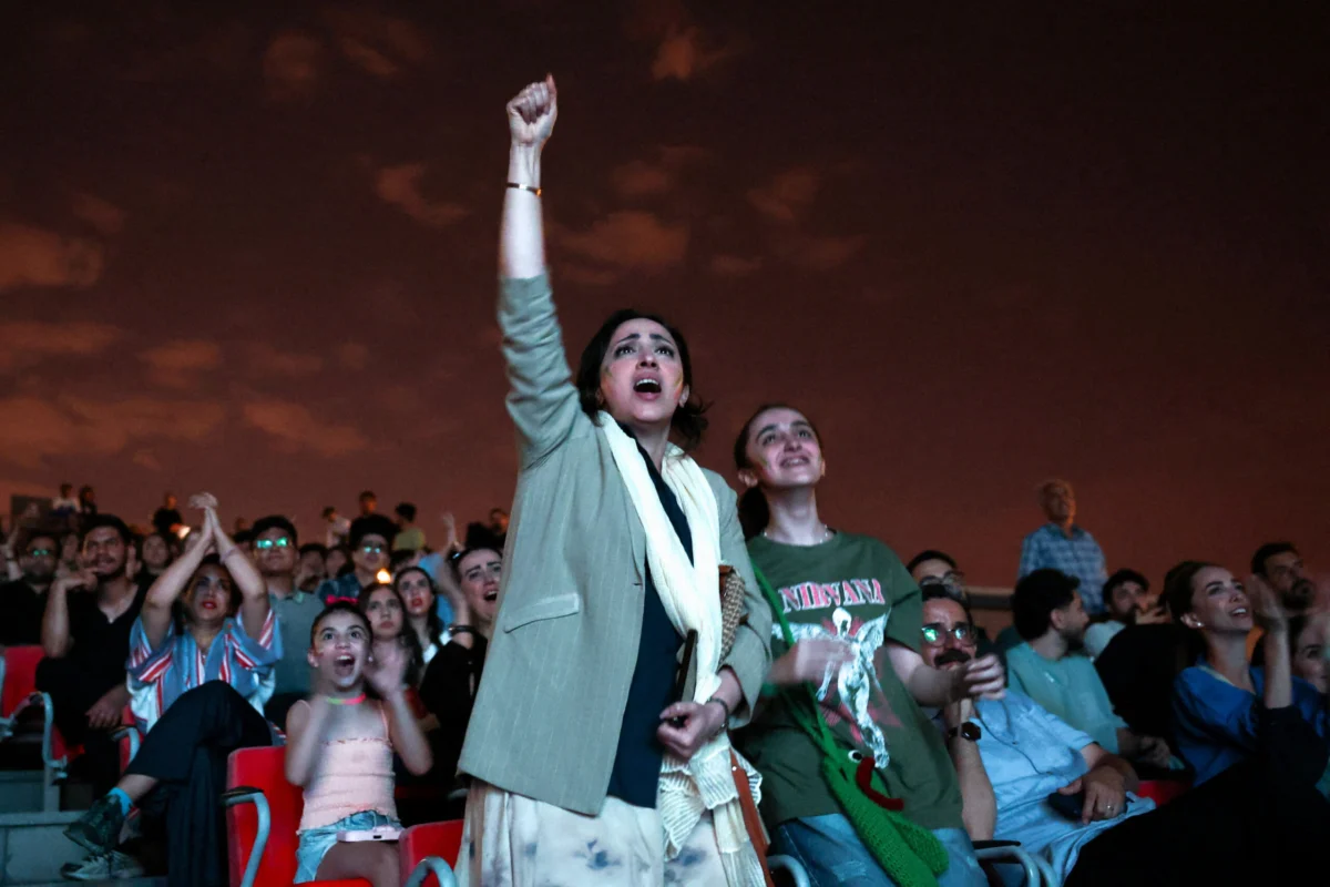 Iranians in Tehran Rally Behind National Team in Tense World Cup Draw Against Belgium, Maintaining Hopes for Knockout Stage Advancement