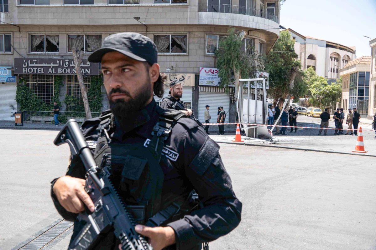 Explosions Rock Damascus During French President Macron’s Visit as Authorities Claim Bombing Cell Apprehended